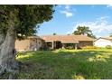 Single-story home with stone exterior and landscaped yard at 4607 Masefield Pl, Sarasota, FL 34241