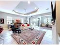 Spacious living room with access to balcony at 13514 Messina Loop # 102, Bradenton, FL 34211