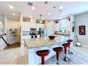Kitchen with large island and granite countertops at 13514 Messina Loop # 102, Bradenton, FL 34211