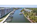 Waterfront view with boat slips and walkway at 1703 N Tamiami Trl # 504, Sarasota, FL 34234