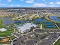 Aerial view of community with resort-style pool and tennis courts at 15425 White Linen Dr, Bradenton, FL 34211