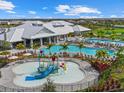 Large resort-style pool with a splash pad and clubhouse at 15425 White Linen Dr, Bradenton, FL 34211