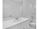A well-lit bathroom boasts a single vanity with a quartz countertop, complemented by a tub and shower combo at 3063 Novara Ln, Lakewood Ranch, FL 34211