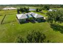 Aerial view of home with large yard, showcasing its curb appeal at 5016 Palangos Dr, Punta Gorda, FL 33982