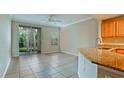 Bright open floorplan with access to the screened lanai, granite countertops, and tile floors at 4751 Travini Circle # 4-116, Sarasota, FL 34235