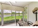 Relaxing sunroom with lake views and comfortable seating at 5519 Fair Oaks St # 2-D, Bradenton, FL 34203