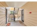 Interior hallway with a staircase and apartment doors at 4802 51St W St # 1305, Bradenton, FL 34210