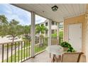 Screened balcony with a table and chairs, overlooking a courtyard at 4802 51St W St # 1305, Bradenton, FL 34210