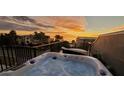 Relax in a rooftop hot tub with sunset views of the ocean and beachfront community at 500 Buttonwood Dr, Longboat Key, FL 34228