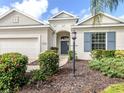 Inviting front entrance showcases a well-maintained home with manicured landscaping and a charming walkway at 11406 Belvedere Ter, Lakewood Ranch, FL 34211