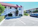 Exterior view of a two-story residential building with parking in front at 1801 Gulf N Dr # 275, Bradenton Beach, FL 34217