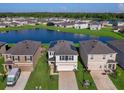 Community overview showcasing houses with lake views and solar panels at 2966 Great Abaco Way, Bradenton, FL 34208