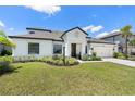 Stunning one-story home with a manicured lawn and well-maintained landscaping in a suburban neighborhood at 4520 Pond Brook Ct, Bradenton, FL 34211