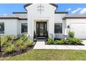 Modern home exterior with a charming front porch at 4520 Pond Brook Ct, Bradenton, FL 34211