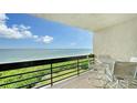 Balcony with patio furniture offering stunning ocean views at 1045 Gulf Of Mexico Dr # 403, Longboat Key, FL 34228