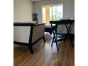 Living room with laminate flooring and access to a balcony at 3780 Lake Bayshore Dr # K-521, Bradenton, FL 34205