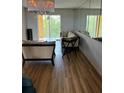 Living room with laminate flooring and access to a balcony at 3780 Lake Bayshore Dr # K-521, Bradenton, FL 34205
