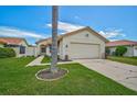 Charming single-story home with a well-manicured lawn and a two-car garage at 4223 Murfield E Dr, Bradenton, FL 34203