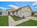 Beautiful single-story home featuring a terracotta roof and lush, green lawn at 4223 Murfield E Dr, Bradenton, FL 34203