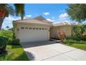 One story home with a two car garage, and nicely landscaped yard at 4140 Reflections Pkwy, Sarasota, FL 34233