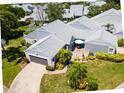 Aerial view of a single-Gathering home with a gray roof and landscaped yard at 3423 52Nd Avenue W Cir # 267, Bradenton, FL 34210