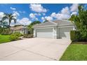 Two-car garage with a long driveway at 5249 Far Oak Cir, Sarasota, FL 34238