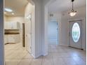 Bright entryway with view of kitchen and living room at 4271 Cascade Falls Dr, Sarasota, FL 34243