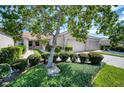 Villa with two-car garage and mature landscaping at 4271 Cascade Falls Dr, Sarasota, FL 34243