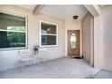 Covered front porch with French doors at 4271 Cascade Falls Dr, Sarasota, FL 34243