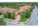 Luxury home community aerial view, featuring upscale houses and landscaping at 14215 Kinglet Ter, Lakewood Ranch, FL 34202