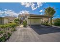 Condo with carport and landscaping, showcasing its exterior at 684 Bird Bay W Dr # 132, Venice, FL 34285