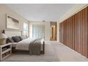 Main bedroom with carpeted floor and built-in wooden closet at 4109 66Th Street W Cir # 4109, Bradenton, FL 34209