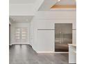 Modern home entry with grey tile floors and white doors at 2234 Hibiscus St, Sarasota, FL 34239