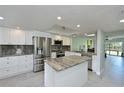 Modern kitchen with stainless steel appliances and granite counters at 6505 Stone River Rd # 104, Bradenton, FL 34203