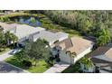 Community view showcasing homes and a pond at 7275 Lismore Ct, Lakewood Ranch, FL 34202