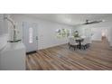 Bright dining room with hardwood floors and modern furniture at 353 Suwanee Ave, Sarasota, FL 34243
