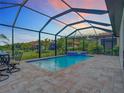 Screened-in pool and spa with patio area for relaxing at 177 Vinadio Blvd, Nokomis, FL 34275