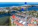 Aerial view of condo, pool, and Sarasota Bay at 1602 Stickney Point Rd # 305, Sarasota, FL 34231