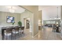 Open concept dining room with view into the living room and kitchen at 4556 31St E Ct, Bradenton, FL 34203