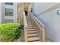 Condo building with stairs leading to unit entrance at 6157 Midnight Pass Rd # C12, Sarasota, FL 34242