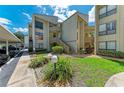 Condo building with parking and landscaped grounds at 6157 Midnight Pass Rd # C12, Sarasota, FL 34242