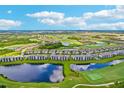 Scenic aerial view of the condo community surrounded by golf courses and lakes at 17704 Gawthrop Dr # 402, Bradenton, FL 34211