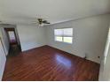 Spacious living room with hardwood floors and ceiling fan at 707 13Th W St, Palmetto, FL 34221