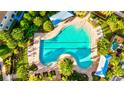 Community pool with lap lanes and surrounding lounge area at 8214 Las Lilias Ct, Sarasota, FL 34243