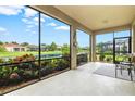 Spacious screened porch overlooking a pond at 8214 Las Lilias Ct, Sarasota, FL 34243