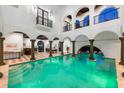 Expansive indoor pool in a grand, luxurious setting at 3482 Flamingo Ave, Sarasota, FL 34242