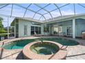 Inviting pool and spa area with a covered patio at 1206 86Th Nw Ct, Bradenton, FL 34209