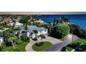 Luxury waterfront home with circular driveway and private dock at 549 Sloop Ln, Longboat Key, FL 34228