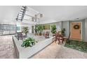 Inviting condo lobby with seating area and courtyard at 1477 Park Beach Cir # 13, Punta Gorda, FL 33950