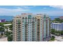 High-rise condo building with water and city views at 800 N Tamiami Trl # 1817, Sarasota, FL 34236